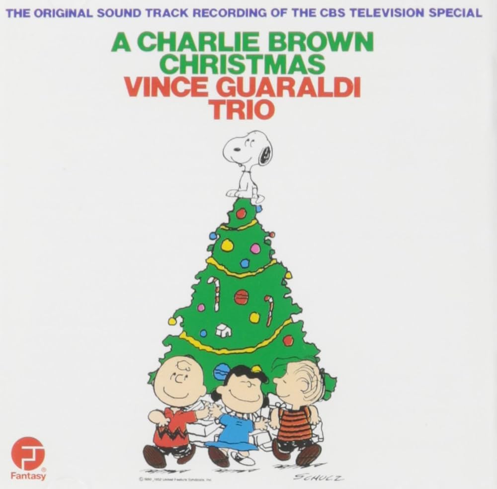Album cover for "Vince Guaraldi Trio - A Charlie Brown Christmas" featuring Charlie Brown, Snoopy, and other characters decorating a Christmas tree, with a tracklist for the green vinyl LP.