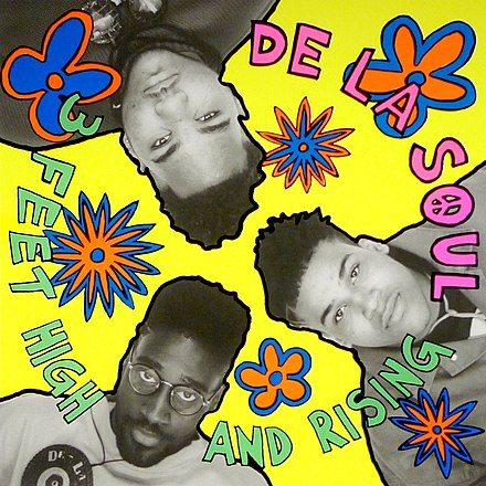 Album cover for Tandem Coffee Roasters' "De La Soul - 3 Feet High and Rising" featuring colorful, psychedelic flowers and comic book-style bursts around black-and-white photos of the three band members' faces in the D.A