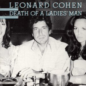 Black-and-white album cover for Leonard Cohen - Death of a Ladies' Man from Tandem Coffee Roasters, showing Cohen seated at a table between two women, with the album title and his name at the top.