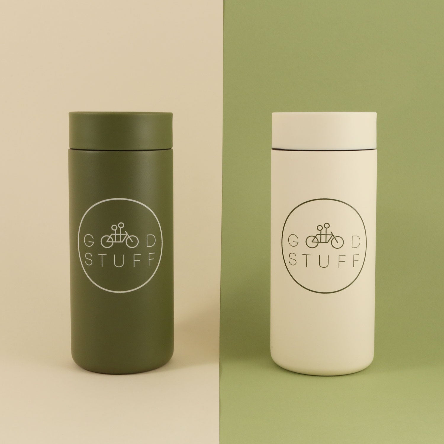 Two MiiR 360 Traveler "GOOD STUFF" mugs on a split background; one is dark green and the other white, both featuring the logo "good stuff" with a bicycle image. Created by Tandem Coffee Roasters.