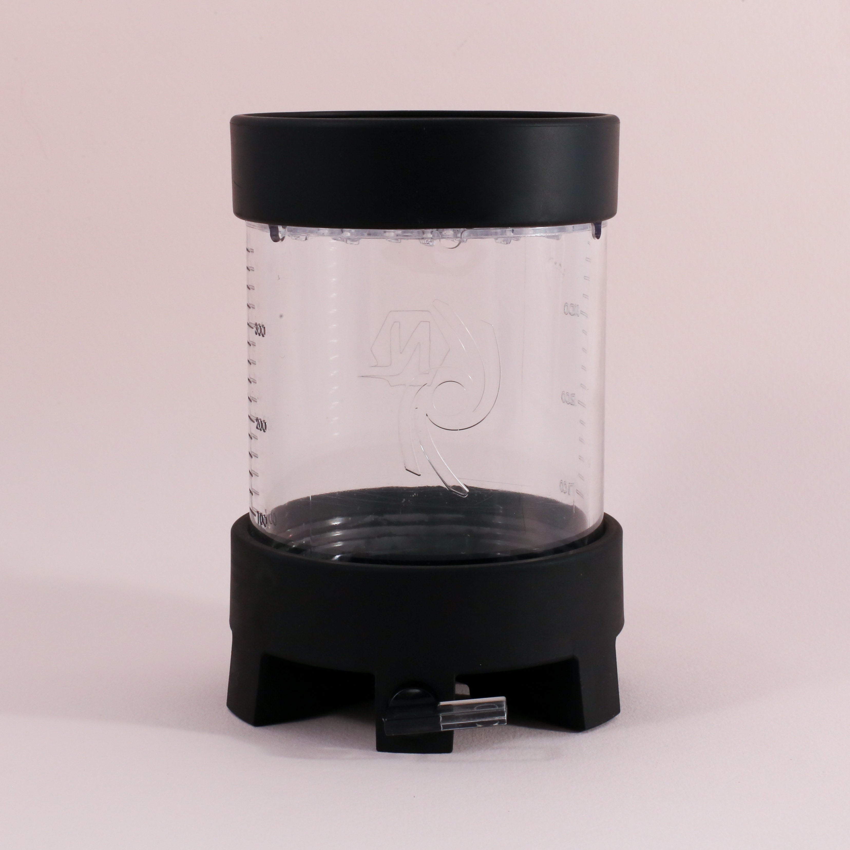 The NextLevel Pulsar Brewer by vendor-unknown is a clear cylindrical container with black top and bottom, side measuring lines, adjustable flow valve spout at the base, and a no bypass design, shown against a plain light background.