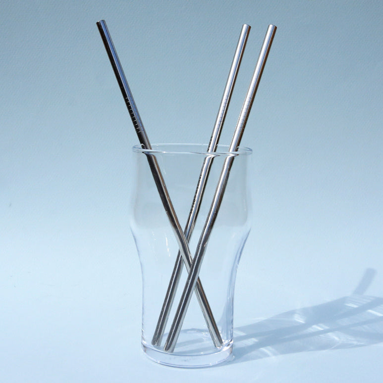 Tandem Reusable Straws in a glass