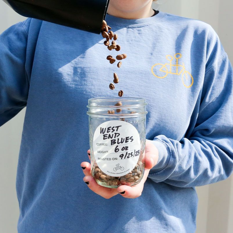 Barista Pouring Beans into Reusable Container