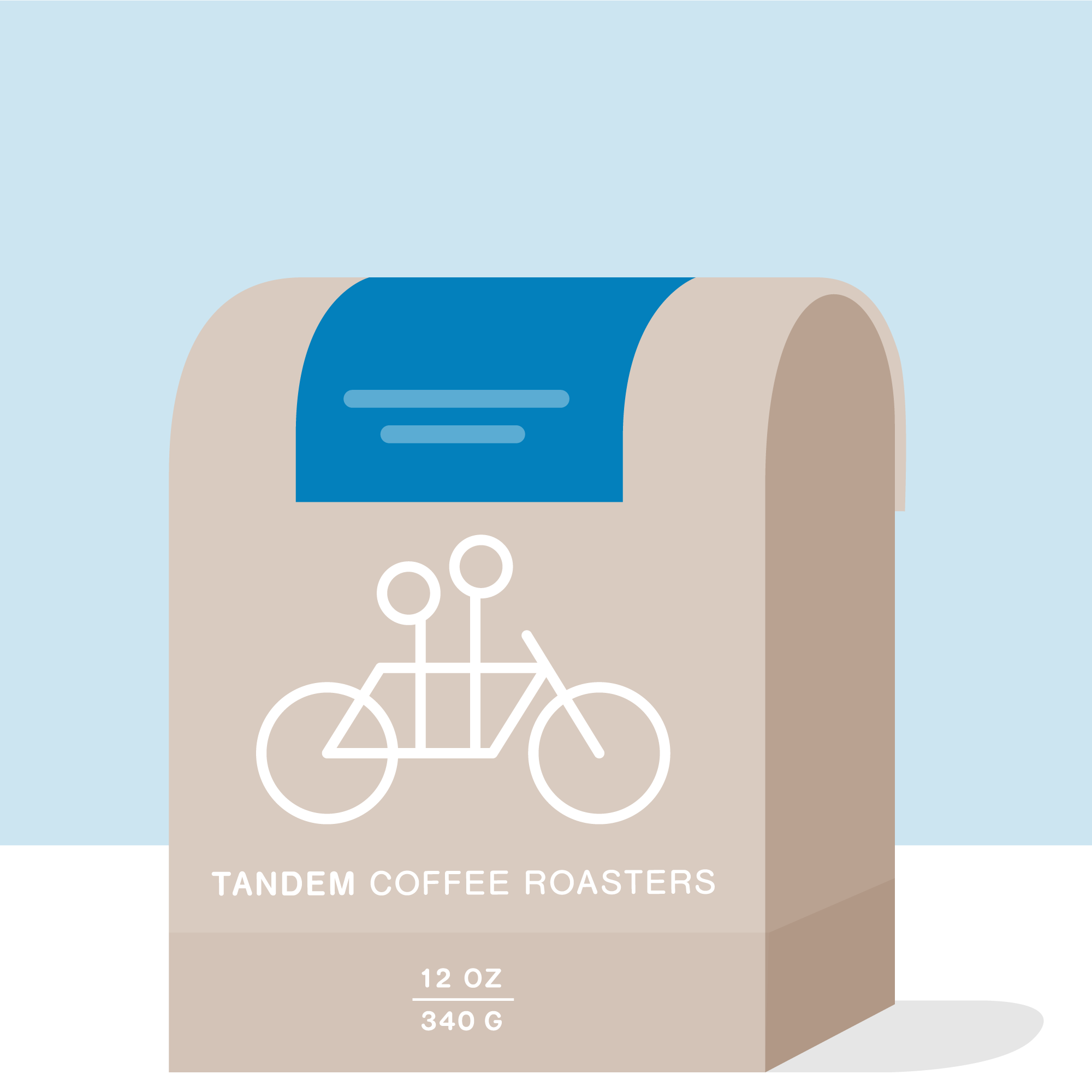 A beige coffee bag labeled Tandem Coffee Roasters features a simple white tandem bicycle graphic with blue accents. The 12 oz (340 g) bag highlights the "Yesica Moreno - Colombia" coffee, crafted using cochadas fermentation from Urrao, Colombia.
