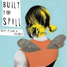 Collaged art of a person with yellow-highlighted hair and wings, in an orange top, with the Built to Spill - Keep It Like a Secret tracklist set on blue. Brand: Tandem Coffee Roasters.