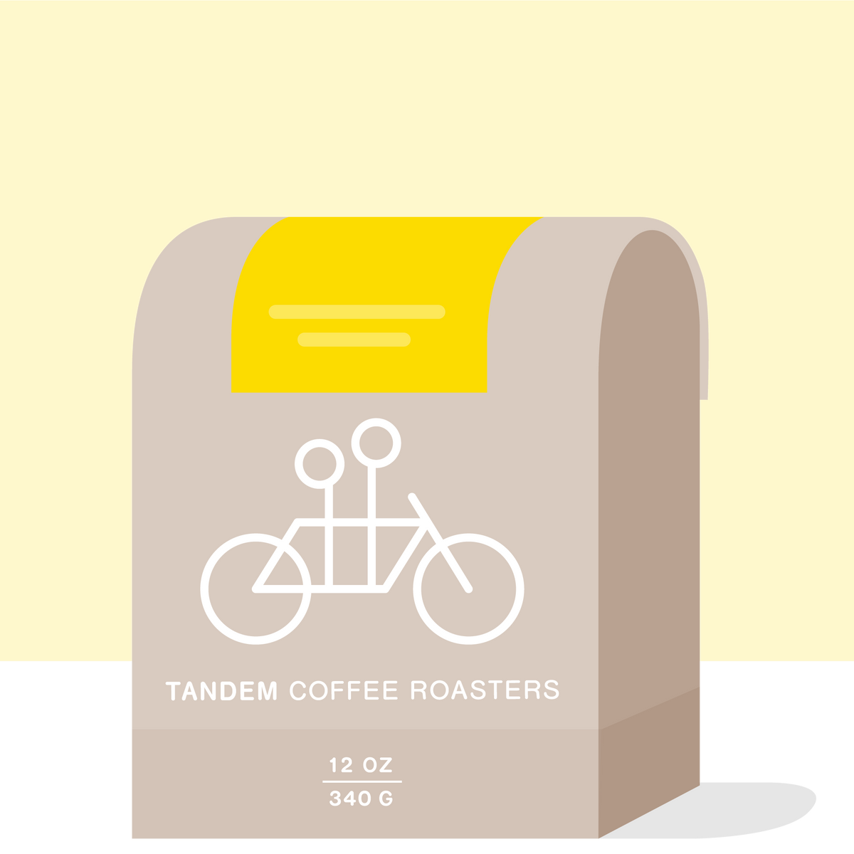 A stylized illustration of a gray Sun Lamp Decaf coffee bag with a tandem bicycle logo, labeled "Tandem Coffee Roasters" and a weight indication of 12 oz or 340 g.