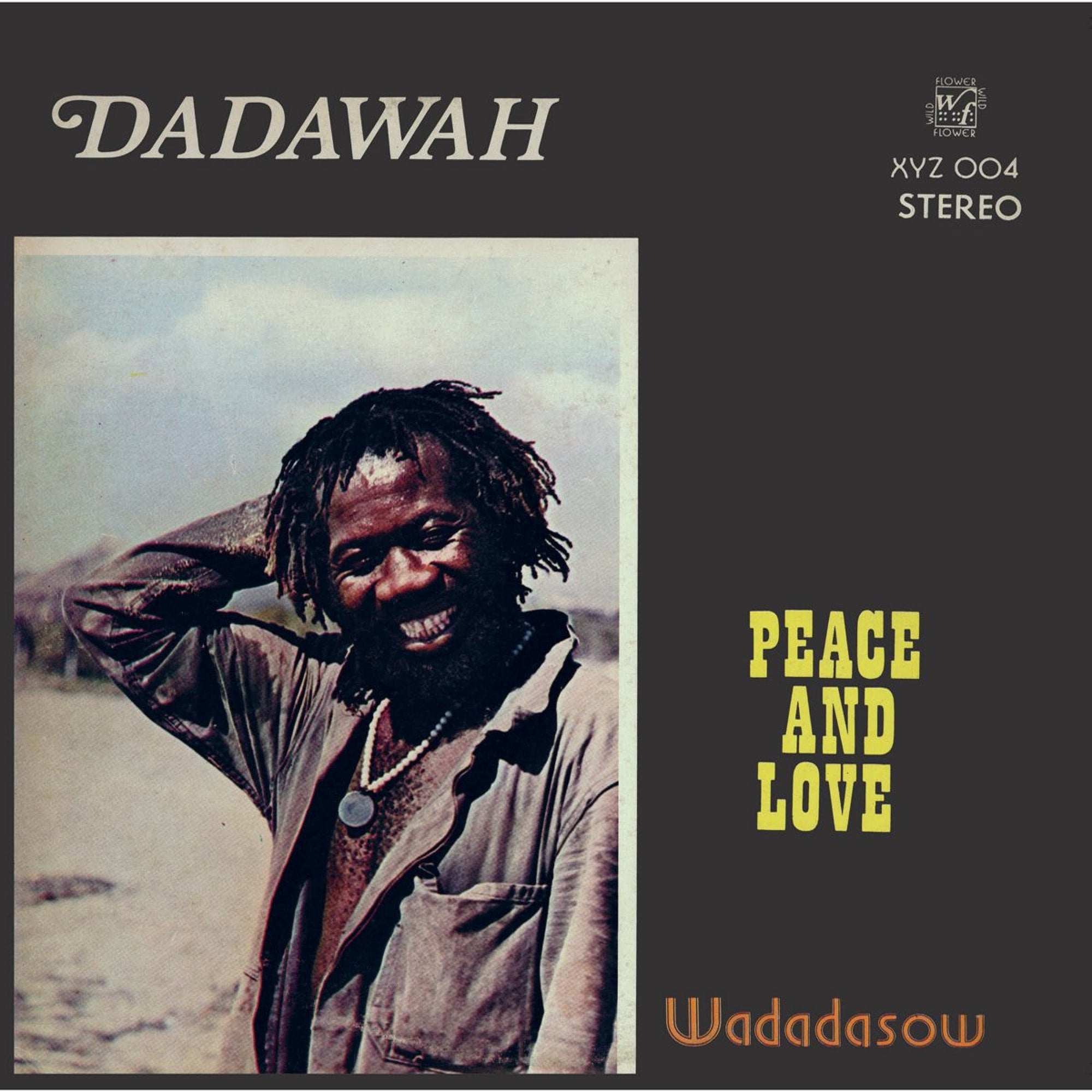 Album cover of Dadawah - Peace and Love by Tandem Coffee Roasters featuring a joyful man with dreadlocks, wearing a dark jacket and smiling broadly against an earth-toned background with bright yellow text.