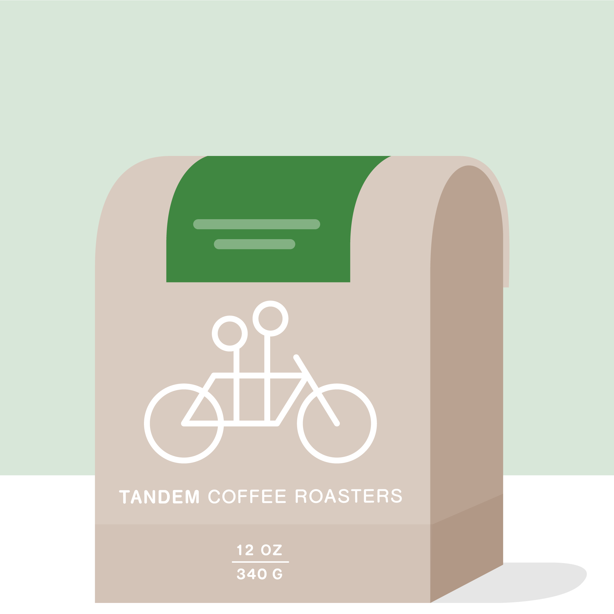 A beige coffee bag with a green top, featuring a white tandem bicycle and “Tandem Coffee Roasters.” Contains 12 oz (340 g) of Carmen Montoya - Colombia coffee, honored in the Cup of Excellence.