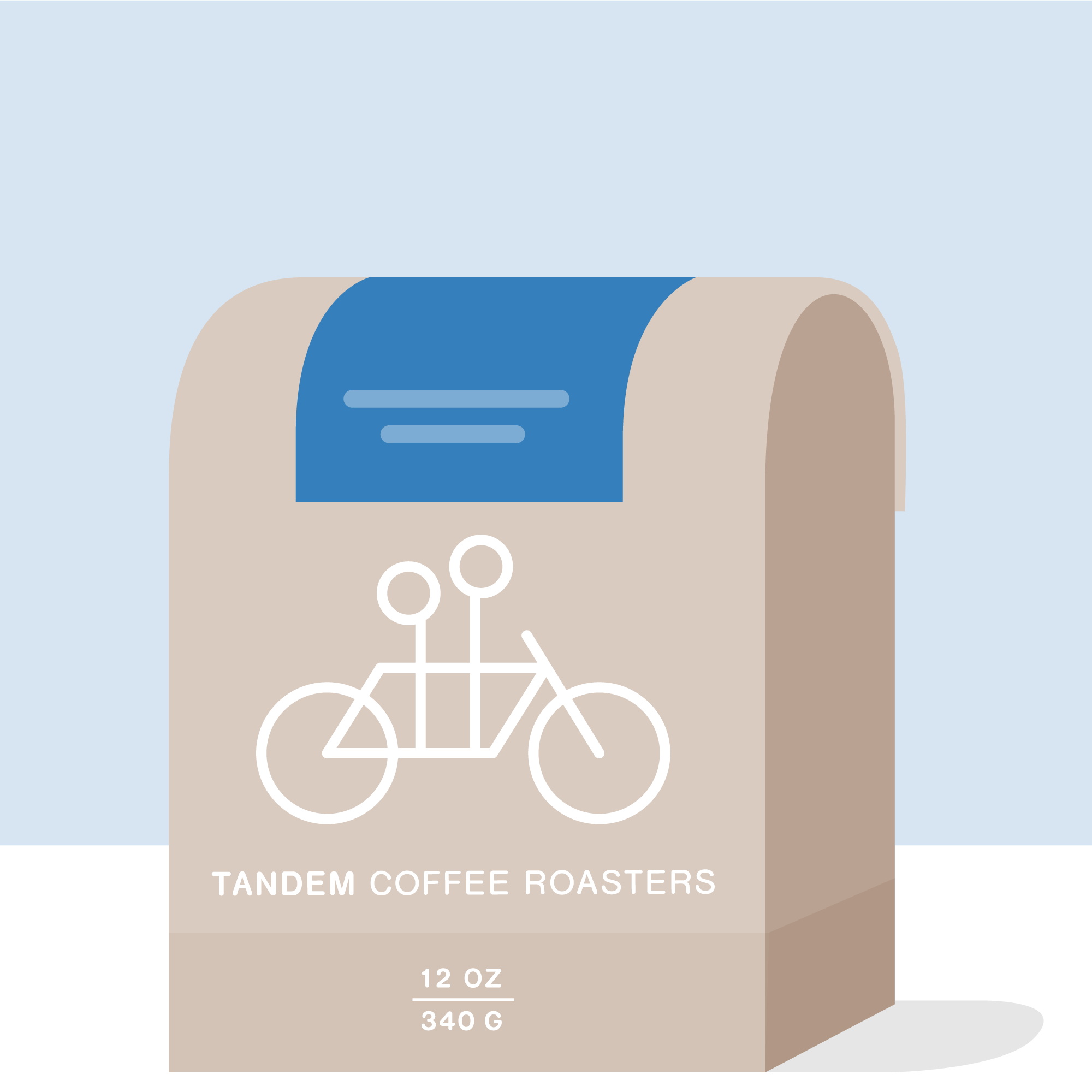 A beige 12 oz (340 g) La Falda - Colombia coffee bag from Tandem Coffee Roasters, featuring a white tandem bicycle drawing, sits on a flat surface against a blue background. The coffee is washed Chiroso from Urrao.