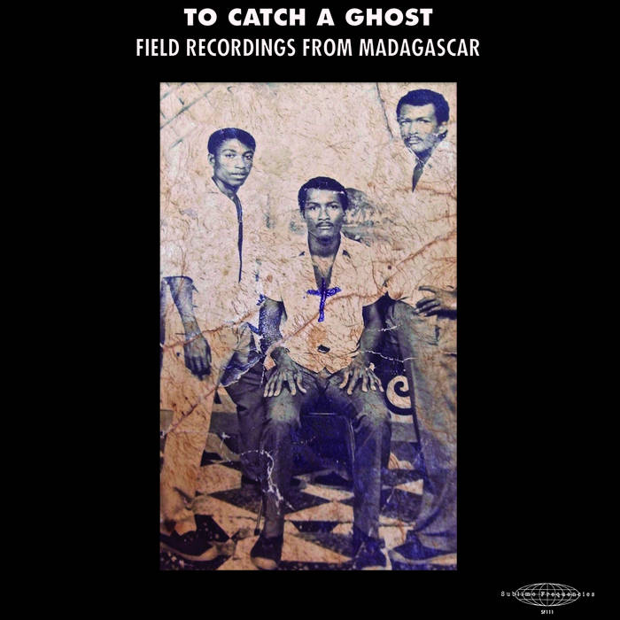 A faded sepia photo shows three Malagasy men—two standing, one seated—staring at the camera. The image bears the title: "Various Artists To Catch A Ghost: Field Recordings from Madagascar" by Tandem Coffee Roasters.