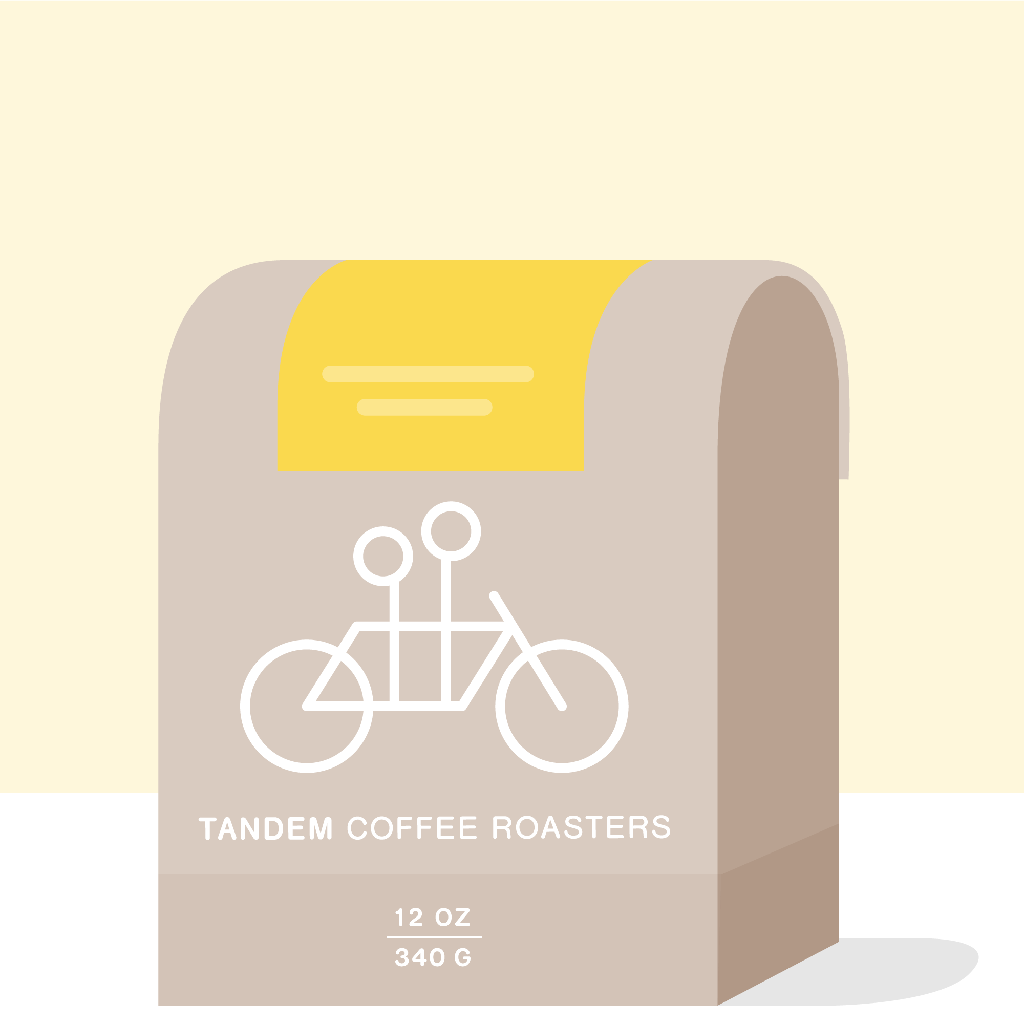 A beige 12 oz (340 g) Tandem Coffee Roasters bag labeled "Paxtle - Mexico" features a white tandem bicycle outline, yellow accent at the top, and sits against a light yellow and white background.