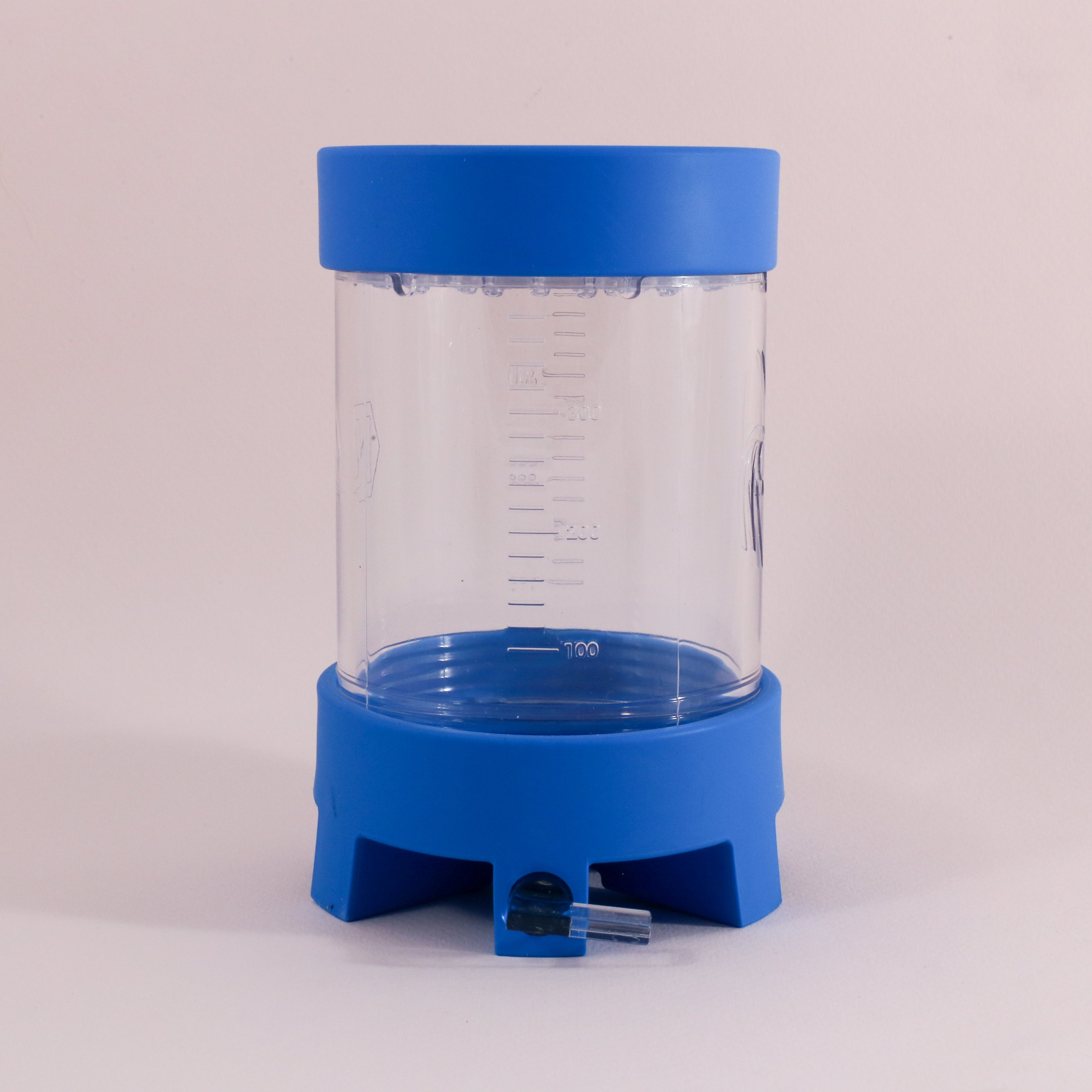 The NextLevel Pulsar Brewer by vendor-unknown is a clear cylinder with blue top and bottom lids, measurement markings, an adjustable flow valve, and a small spout at the base for precise liquid dispensing.