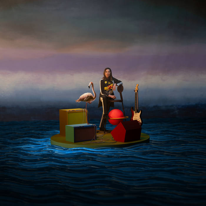 On a small floating platform, a woman sits with a flamingo, guitar, amplifier, red sphere, and geometric shapes beneath a vibrant sky—imagery inspired by Kim Deal - Nobody Loves You More from Tandem Coffee Roasters.