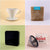 A collage of four images featuring consumer products: a white ceramic Tandem Coffee Roasters V60 Deluxe Kit coffee dripper, a bag of freshly roasted La Piramide coffee, a digital clock displaying "12:00," and