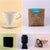 A collage of six objects including a white ceramic Tandem Coffee Roasters V60 Deluxe Kit coffee dripper, a brown bag of freshly roasted La Piramide coffee beans, a digital clock, a black wristwatch.