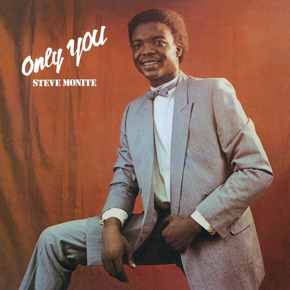 Album cover of "Steve Monite - Only You," issued by Tandem Coffee Roasters, featuring a smiling man in a gray suit seated against an orange backdrop.