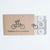 Two physical gift cards for Tandem Bakery, one with a tandem bicycle and logo etched on a cardboard texture, the other featuring a coffee bean design on a translucent background.