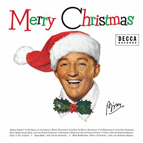 Album cover of "Bing Crosby - Merry Christmas" featuring a smiling man in a Santa hat, with holiday decorations and the Decca Records logo at the bottom.