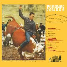 Album cover of "Light Up Gold" by Parquet Courts featuring a man on a bucking horse at a rodeo, with a tracklist on the right side and a small tent graphic in the bottom right, designed by Tandem Coffee Roasters.