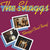 Album cover for "The Shaggs' Own Thing," featuring a title text and four polaroid photos displaying band members playing instruments and posing. The background is a gradient of purple and red shades, capturing their cult