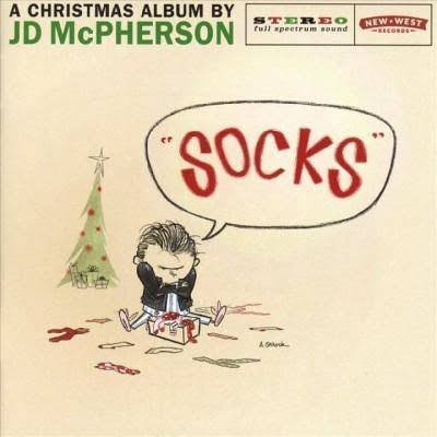 Album cover for Tandem Coffee Roasters' JD McPherson - Socks featuring a cartoon drawing of a disappointed boy holding up a gift of socks, with a Santa and Christmas tree in the background.