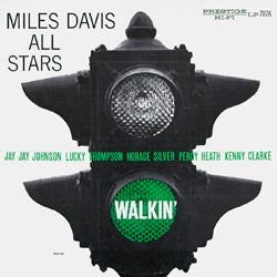 Album cover for Tandem Coffee Roasters' Miles Davis All Stars - Walkin' featuring an elegant dinner party setting with a monochrome image of a vintage microphone within a star-shaped outline, and artist and album names including featured musicians listed.