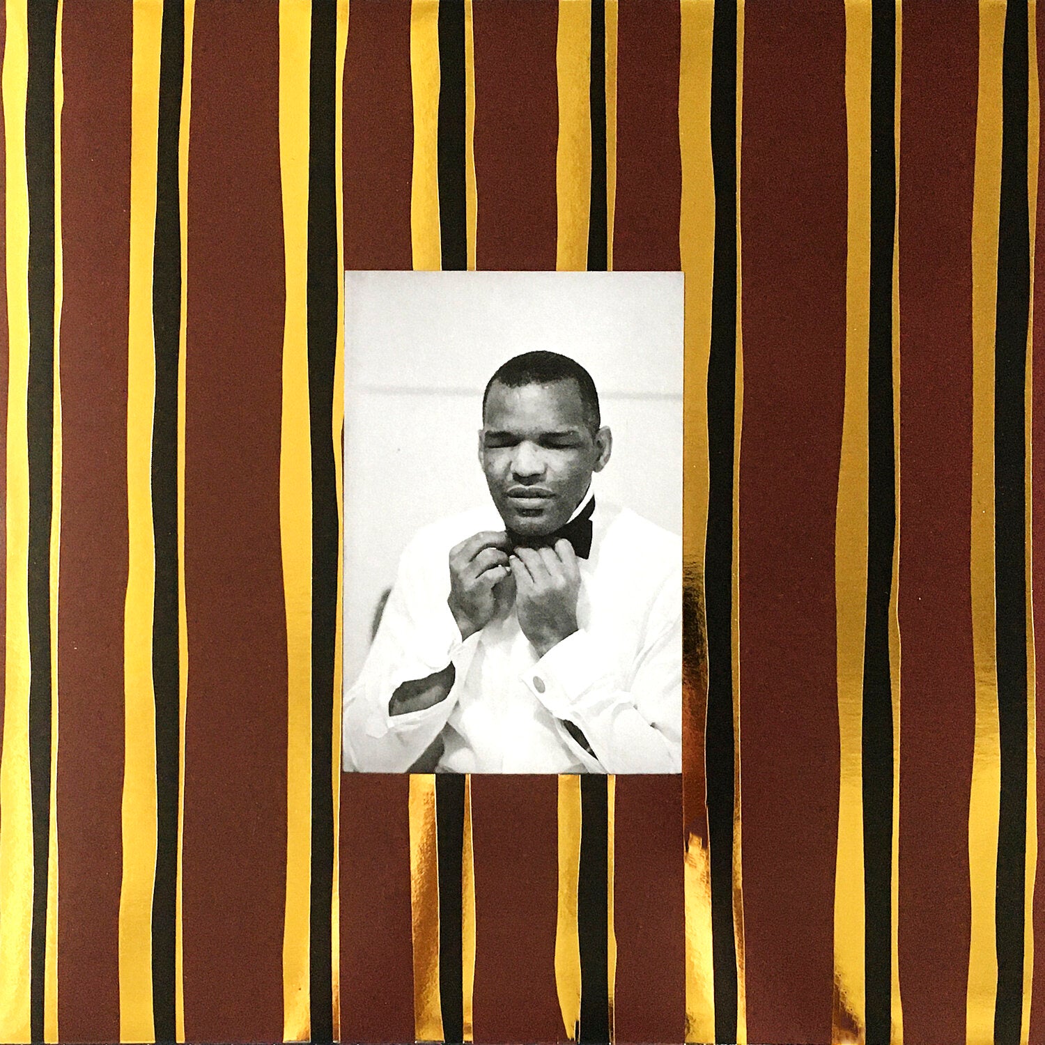 A black-and-white photo of a man in a white shirt adjusting his bow tie is centered on gold and brown stripes, reflecting the sophisticated vibe of Tandem Coffee Roasters' American Soul Music (and one song from Ghana) 1955-1988 – The World is a Cafeteria.